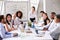 Asian Businesswoman Leading Meeting At Boardroom Table