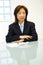 Asian businesswoman at table