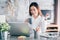 Asian businesswoman take a coffee break after working at laptop