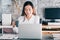 Asian businesswoman take a coffee break after working at laptop