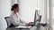 Asian businesswoman working in her office, typing on her computer