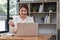 Asian call center with headset and microphone working on her laptop. Female operator provide exceptional customer