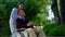 Asian careful caregiver or nurse taking care of the patient in a wheelchair. Concept of happy retirement with care from a