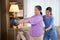 Asian caregiver woman or nurse training senior woman lifting sport ball with hands for exercise while physical therapy.