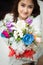 Asian Caucasian giving bouquet of colorful flowers