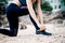 Asian caucasian woman practicing yoga at seashore at morning