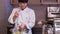 Asian chef standing in kitchen of sushi bar