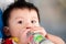 Asian child boys eating milk from bottles