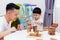 Asian child and father playing with wooden blocks in the room at home. A kind of educational toys for preschool and kindergarten