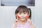 Asian child girl enjoy eating and biting strawberry fruit.