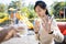 Asian child girl gesturing no to glass of milk,female teenage refusing fresh milk while play in playground,woman rejecting to