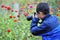 Asian child taking macro picture