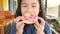 Asian children eating sweet donuts