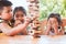 Asian children playing wood blocks stack game together with fun