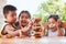 Asian children playing wood blocks stack game together with fun