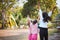 Asian children raise hands and playing together with fun