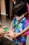 Asian children using liquid gel hand sanitizer