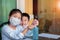 Asian children wearing face protection mask and  cleaning hand by alcohol gel