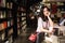 Asian Chinese beautiful pretty young cute woman girl student Teenager read book in bookstore library smile spend her pastime