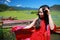 Asian Chinese beauty in red dress enjoy peaceful and happy life at Yunnan Lugu grass lake
