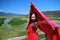 Asian Chinese beauty in red dress enjoy peaceful and happy life at Yunnan Lugu grass lake