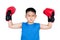 Asian Chinese boy wearing boxing gloves with victory