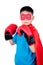 Asian Chinese boy wearing super hero costume with boxing gloves