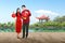 Asian Chinese couple in cheongsam dress holding Chinese lantern