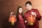 Asian Chinese couple in cheongsam dress holding Chinese lantern