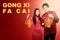 Asian Chinese couple in cheongsam dress holding Chinese lantern and Gong Xi Fa Cai text