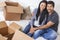Asian Chinese Couple Unpacking Boxes Moving House