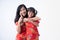 Asian Chinese daughter and mother smile and hug together