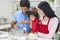 Asian Chinese Family Cooking in Home Kitchen