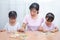 Asian Chinese Family Playing with colorful wooden alphabet toys