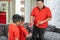 Asian chinese father give ang pao to her sons