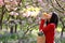 Asian Chinese freedom woman smiling and smell fruit in nature in spring outdoor