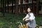 Asian Chinese Happy cute adorable lovely student ride yellow shared bicycle in school before her classroom look at sky