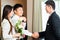 Asian Chinese hotel manager welcome VIP guests