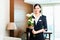 Asian Chinese hotel manager welcomes arriving VIP guests