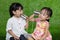 Asian Chinese Kids Playing with Tin Can Phone