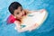 Asian Chinese Little Boy Swimming With Floating Board