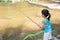 Asian Chinese little girl angling with fishing rod