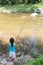 Asian Chinese little girl angling with fishing rod