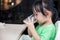 Asian Chinese little girl drinking beverage