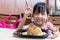 Asian Chinese little girl eating fried rice