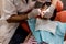 Asian Chinese little girl lying down for tooth extraction