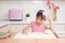 Asian Chinese little girl making dumpling in the kitchen