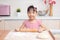 Asian Chinese little girl making dumpling in the kitchen