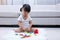 Asian Chinese little girl playing blocks on the floor