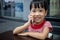 Asian Chinese little girl playing smartphone